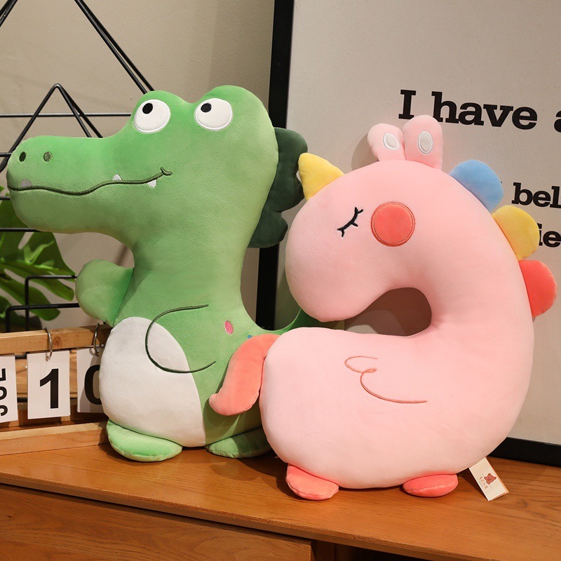 Green Crocodile and Pink Unicorn Plush Pillows displayed together, showcasing two animal designs for decorating cozy living spaces and everyday comfort