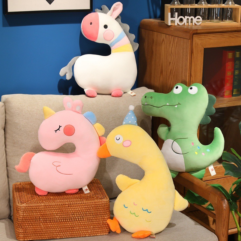Unicorn, Duck, Zebra and Crocodile Plush Pillows displayed in a cozy living space, showcasing four animal designs for hugging, relaxing, and decorating sofas, chairs, and bedrooms