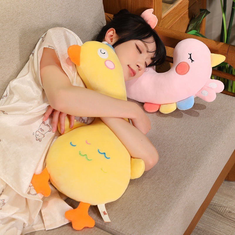 Pink Unicorn and Yellow Duck Plush Pillows shown for hugging, resting, and cozy naps on a sofa