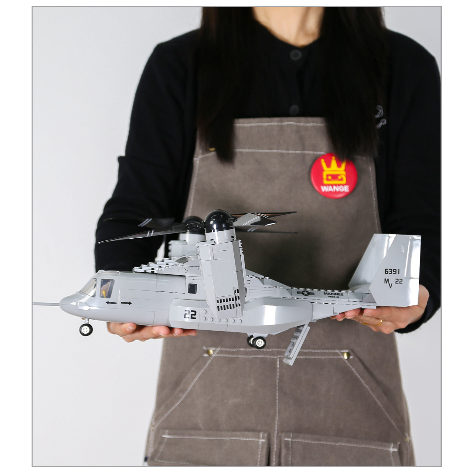 WANGE V-22 Osprey building blocks tiltrotor aircraft model shown for assembled size reference, highlighting the rotating propellers, detailed cockpit, landing gear, and realistic military aircraft design