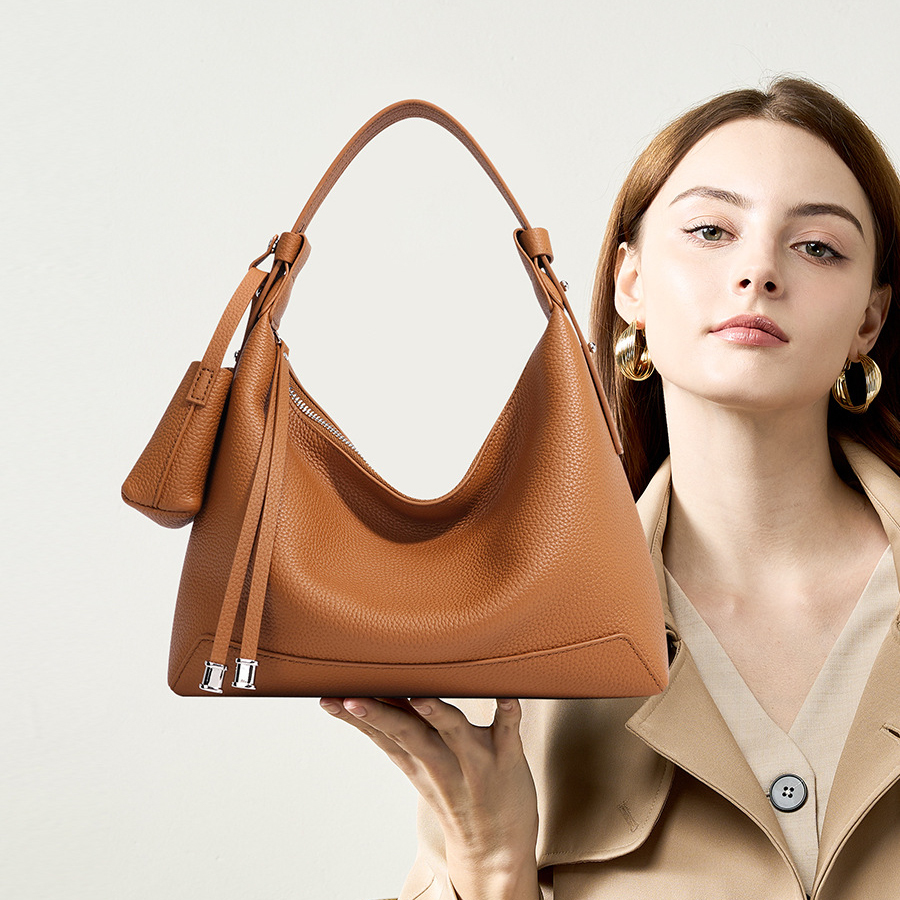 Model showcasing Chic Luxury Leather Hobo Bag in Golden Brown