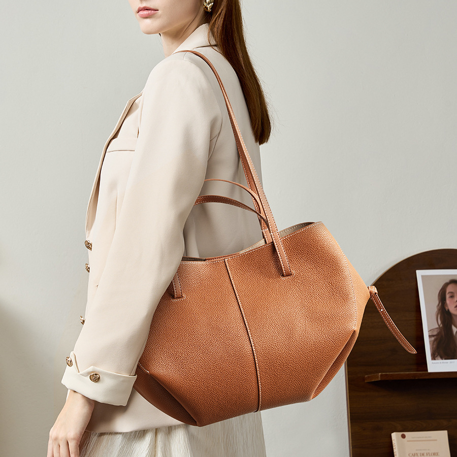 Model carrying Urban Commuter Leather Tote Bag in Brown – on shoulder style