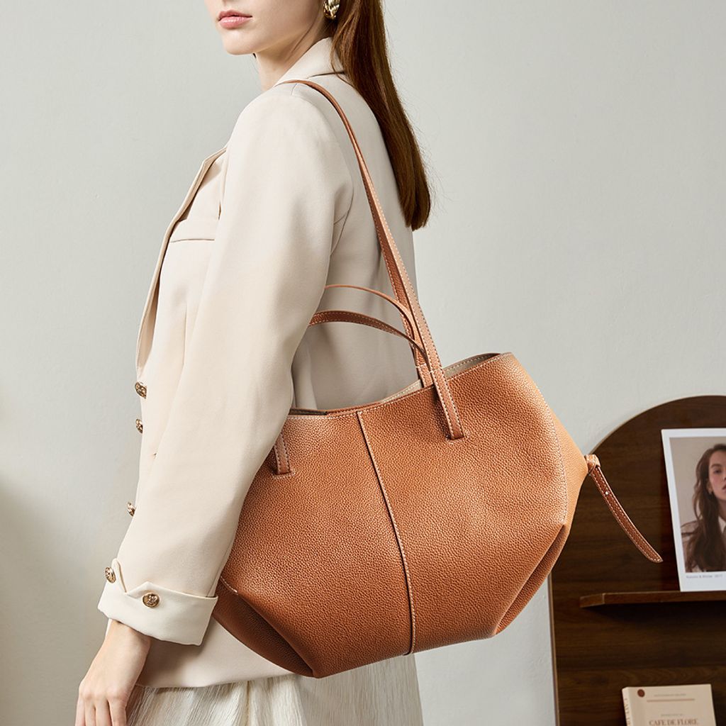 Model carrying Urban Commuter Genuine Leather Tote Bag in Brown – on shoulder style