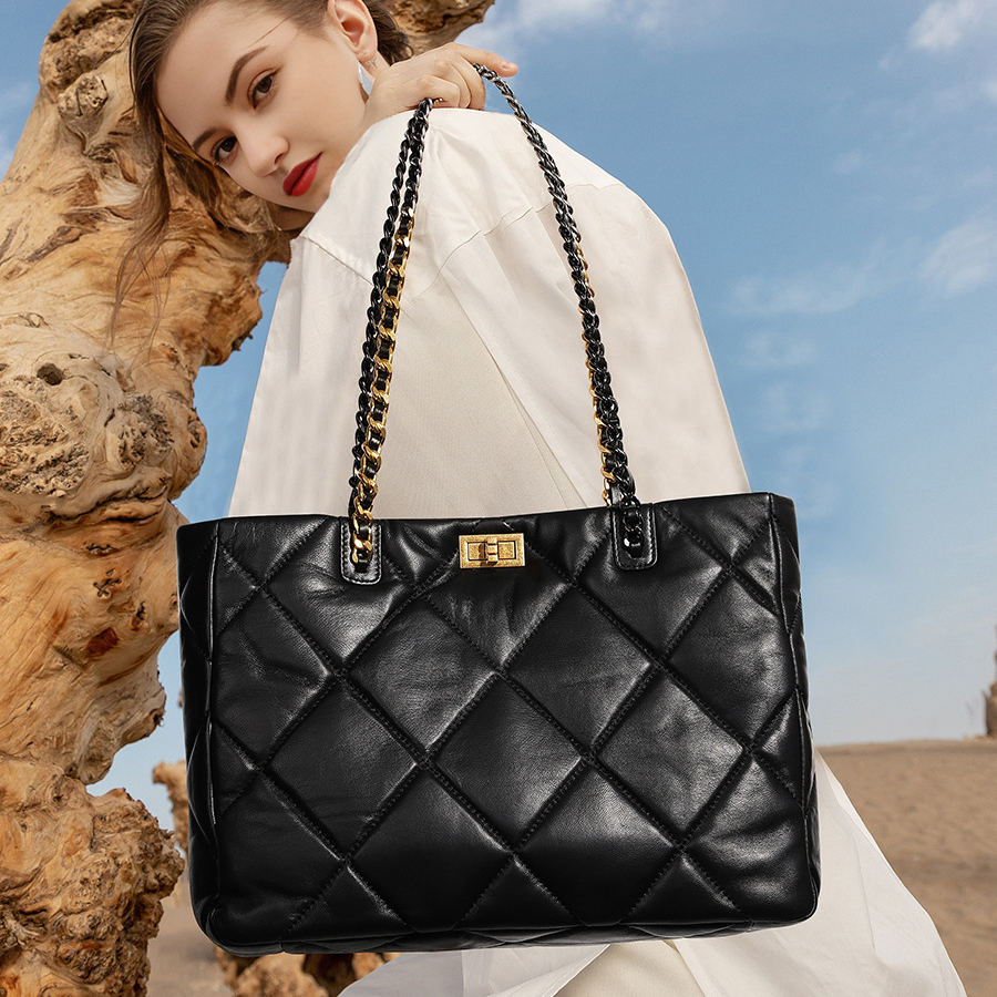 Model showcasing Elegant Quilted Leather Chain Tote Bag in Black