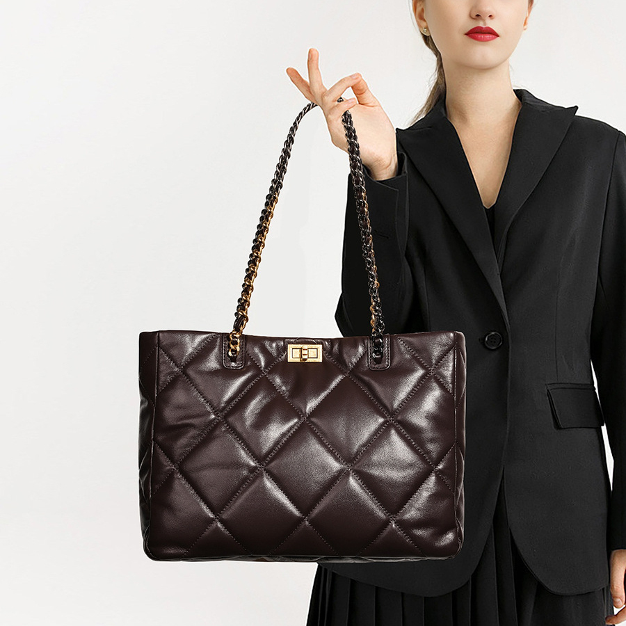 Model showcasing Elegant Quilted Leather Chain Tote Bag in Coffee
