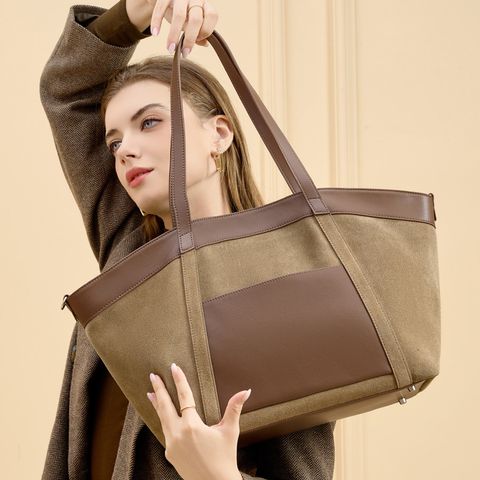 Model showcasing Genuine Suede Leather Retro Tote Bag in Khaki