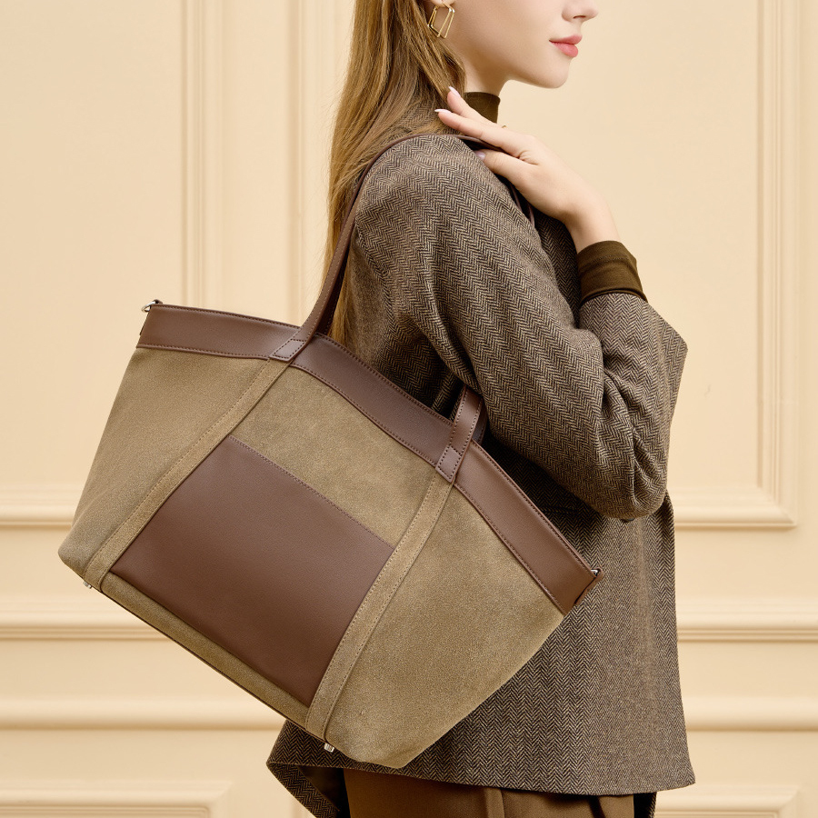 Model carrying Suede Leather Retro Tote Bag in Khaki