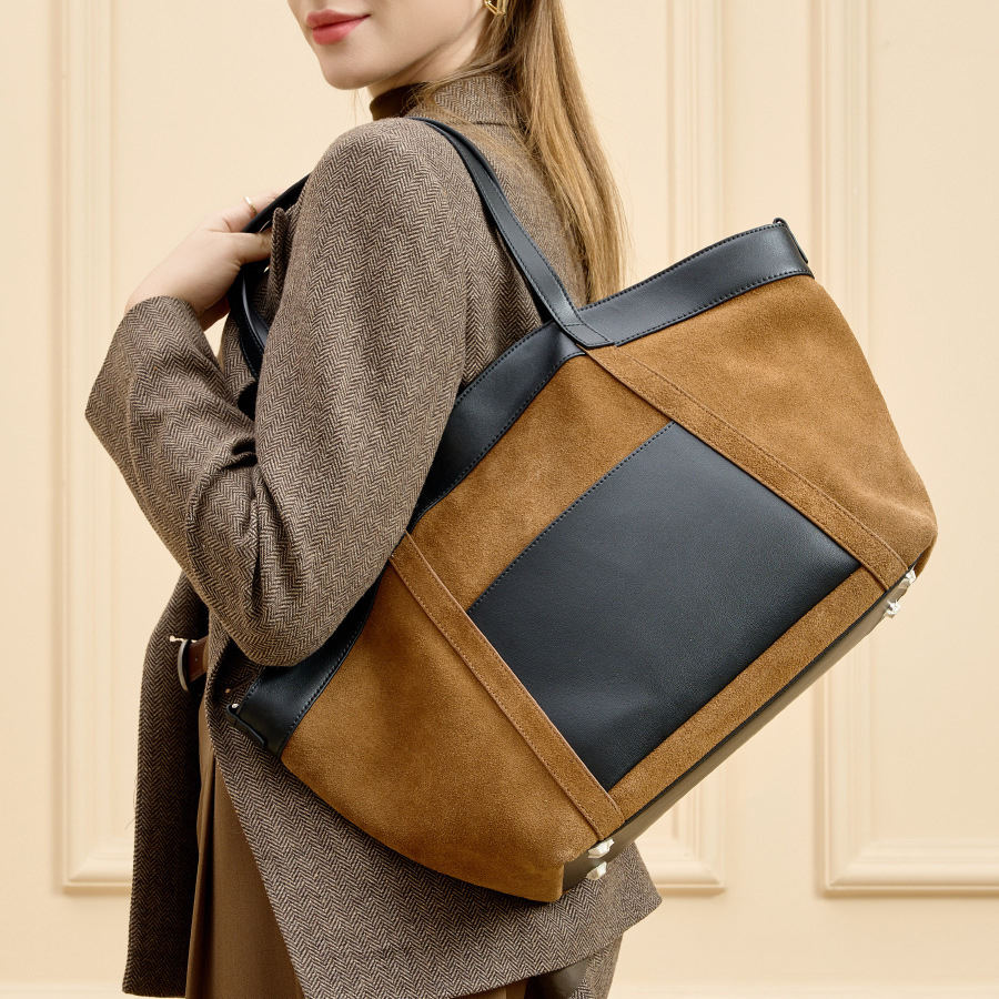 Model carrying Suede Leather Retro Tote Bag in Caramel