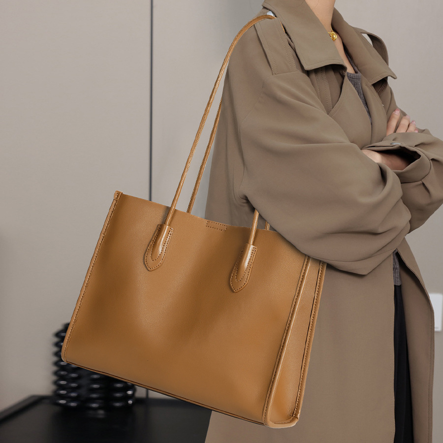 Model showcasing Premium Structured Leather Tote Bag in Golden Brown