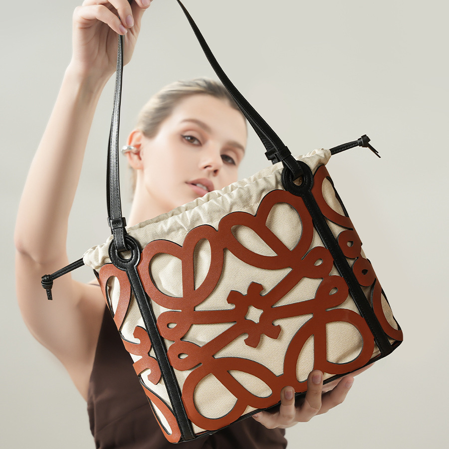Model showcasing Premium Leather Cut-Out Tote Bag in Brown