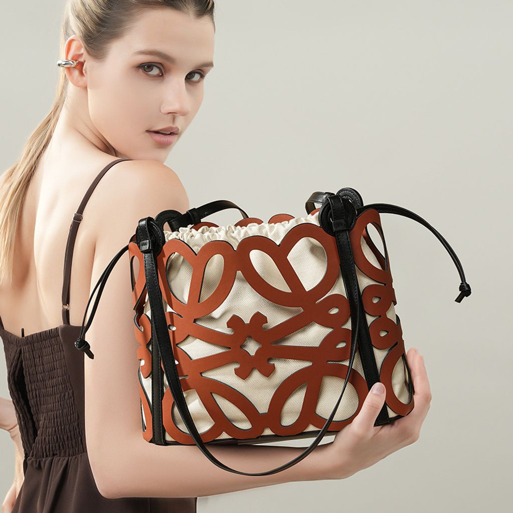Model showcasing Premium Genuine Leather Cut-Out Tote Bag in Brown