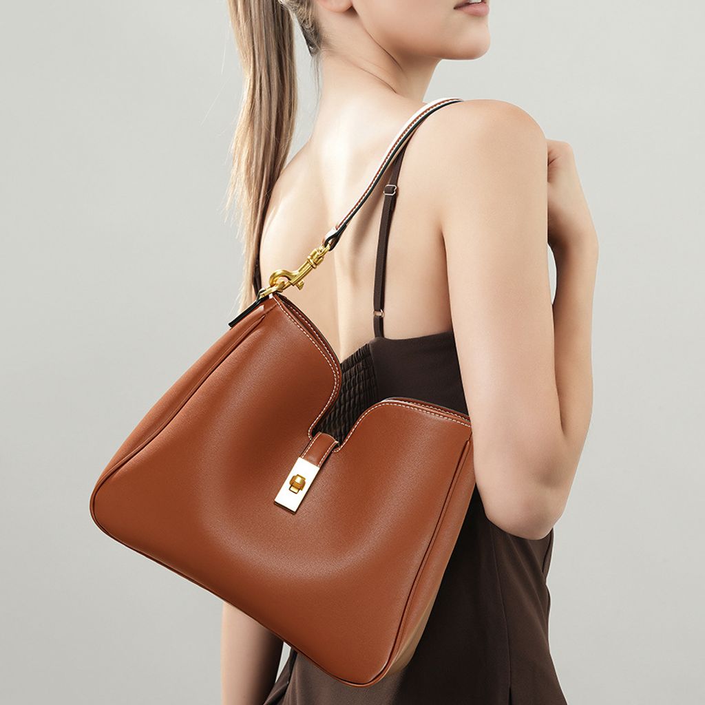 Model carrying Premium Genuine Leather Structured Hobo Bag in Brown
