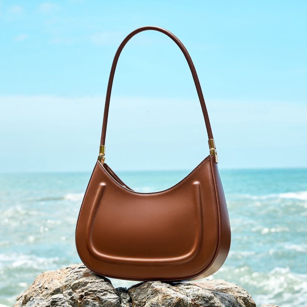 Oil Waxed Leather Minimalist Half Moon Bag in Caramel – Lifestyle Shot