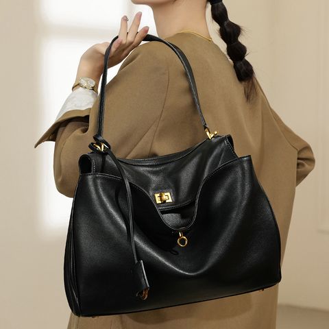 Model showcasing Premium Rodeo Genuine Leather Top Handle Tote Bag in Black (Gold-Tone Lock)