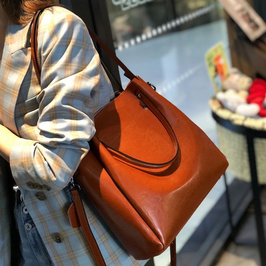 Model showcasing Elegant Oil Waxed Leather Top Handle Tote Bag in Caramel