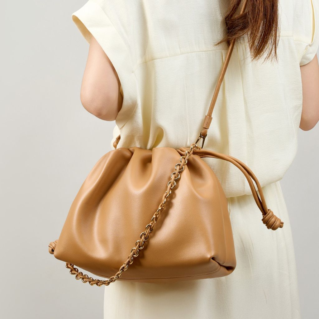 Model showcasing Elegant Genuine Leather Cloud Bag in Brown
