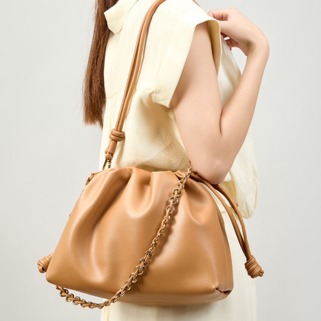 Model showcasing Elegant Genuine Leather Cloud Bag in Brown