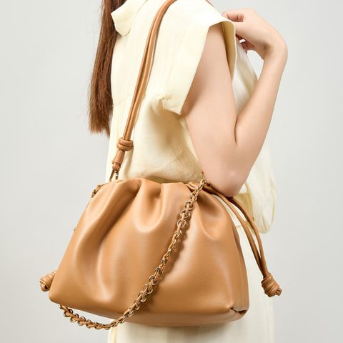 Model showcasing Elegant Genuine Leather Cloud Bag in Brown