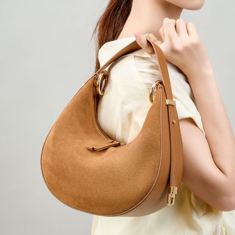 Model showcasing Refined Luna Genuine Leather Half Moon Bag in Fallen Leaf Yellow