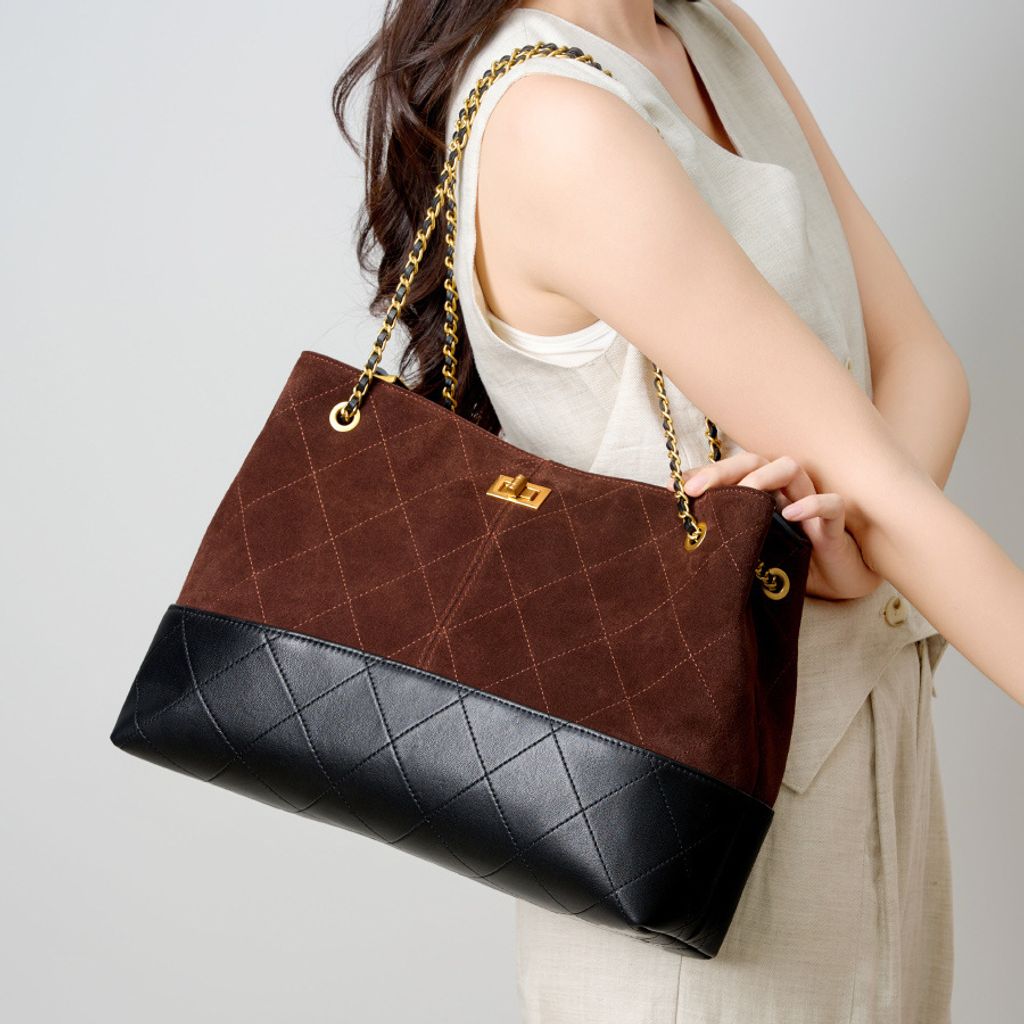 Model showcasing Premium Genuine Leather Two-Tone Chain Bucket Bag in Coffee
