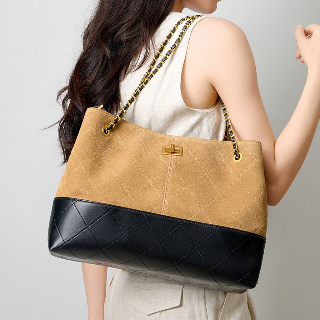 Model showcasing Premium Genuine Leather Two-Tone Chain Bucket Bag in Brown