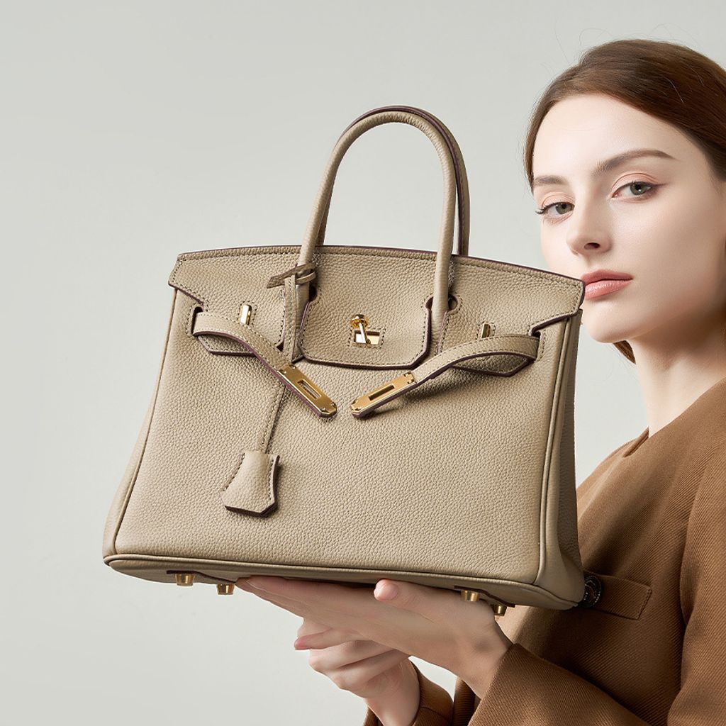 Model showcasing Premium Togo Leather Structured Top Handle Bag in Khaki