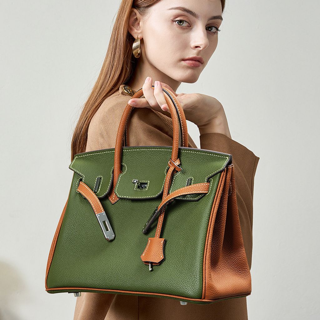 Model showcasing Premium Togo Leather Structured Two-Tone Top Handle Bag