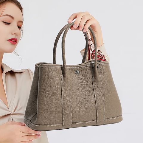 Model with Premium Togo Leather Structured Tote Bag in Khaki