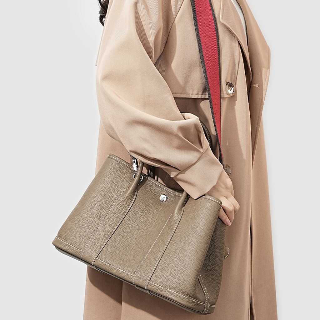 Model carrying Premium Togo Leather Structured Tote Bag in Khaki on Shoulder