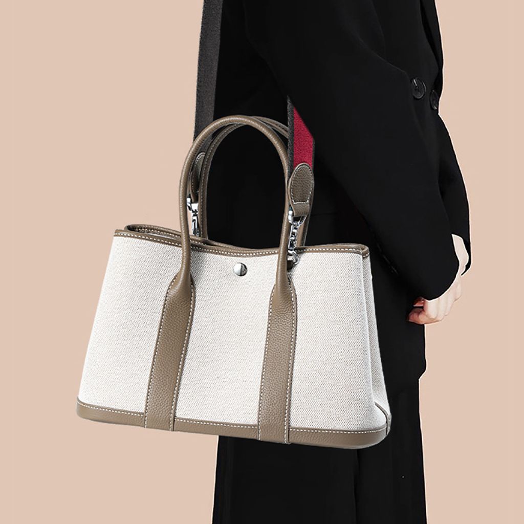 Model carrying Premium Genuine Leather and Canvas Structured Tote Bag in Khaki