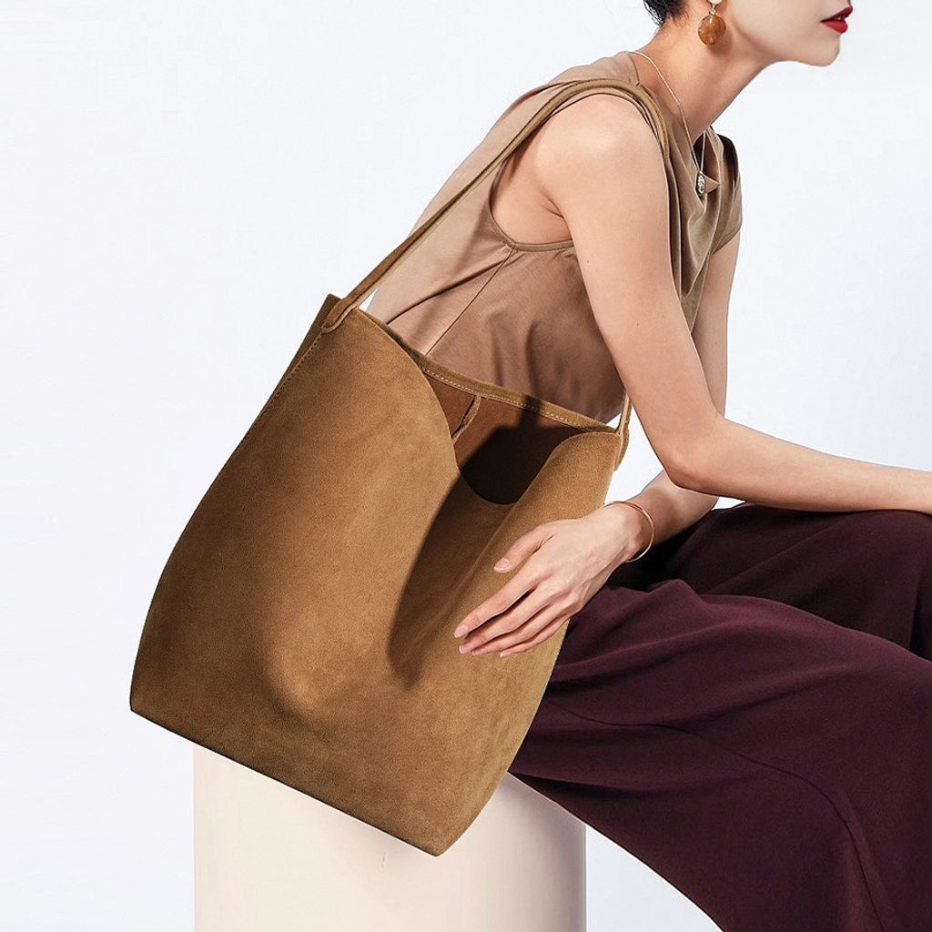 Model showcasing the Refined Suede Leather Bucket Tote Bag in Caramel (Large Size)