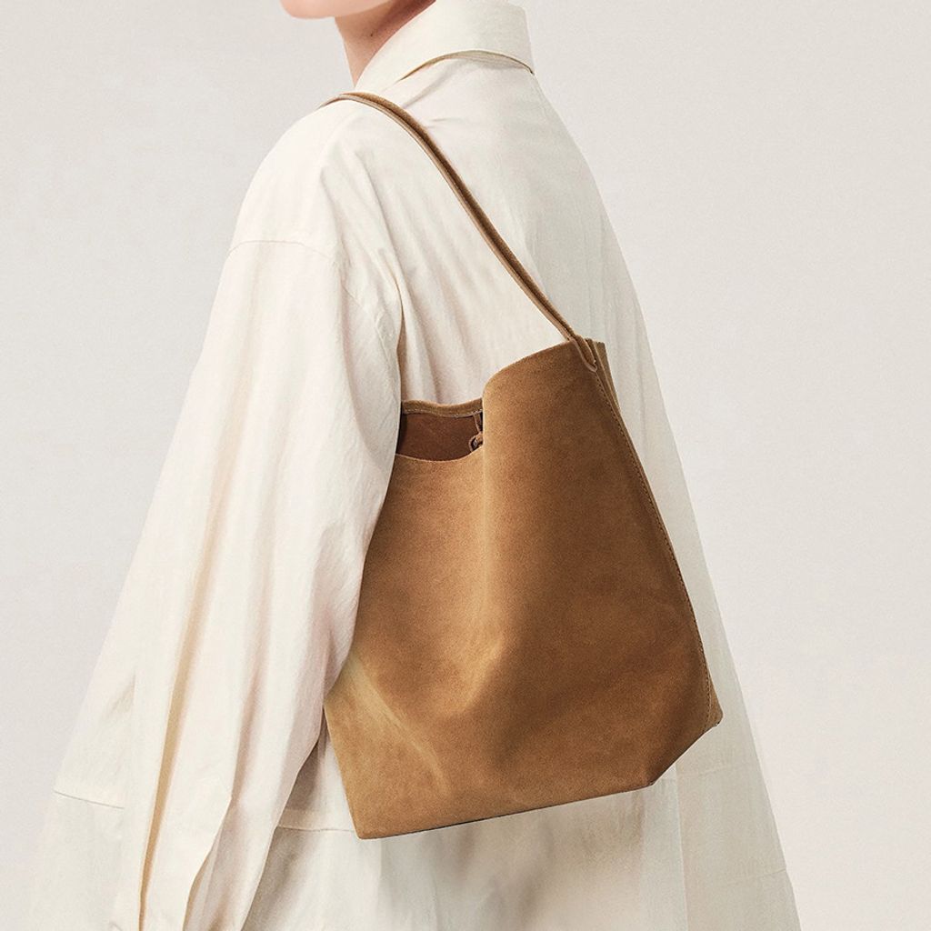 Model showcasing the Refined Suede Leather Bucket Tote Bag in Caramel (Small Size)