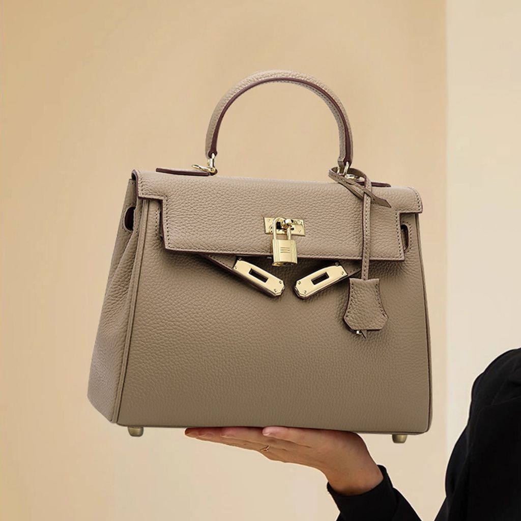 Model showcasing Premium Togo Leather Structured Top Handle Bag in Khaki