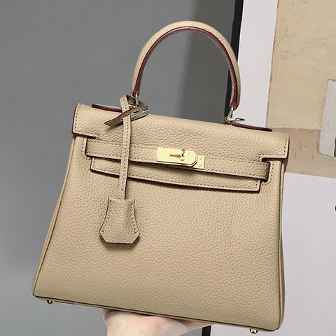 Model showcasing Premium Togo Leather Structured Top Handle Bag in Elephant Gray