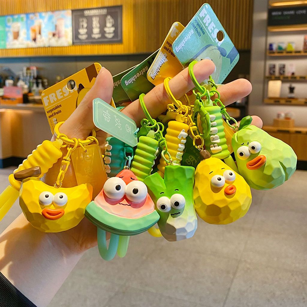 Cute wacky fresh fruit and vegetable wood carving style keychain charms showing all five designs