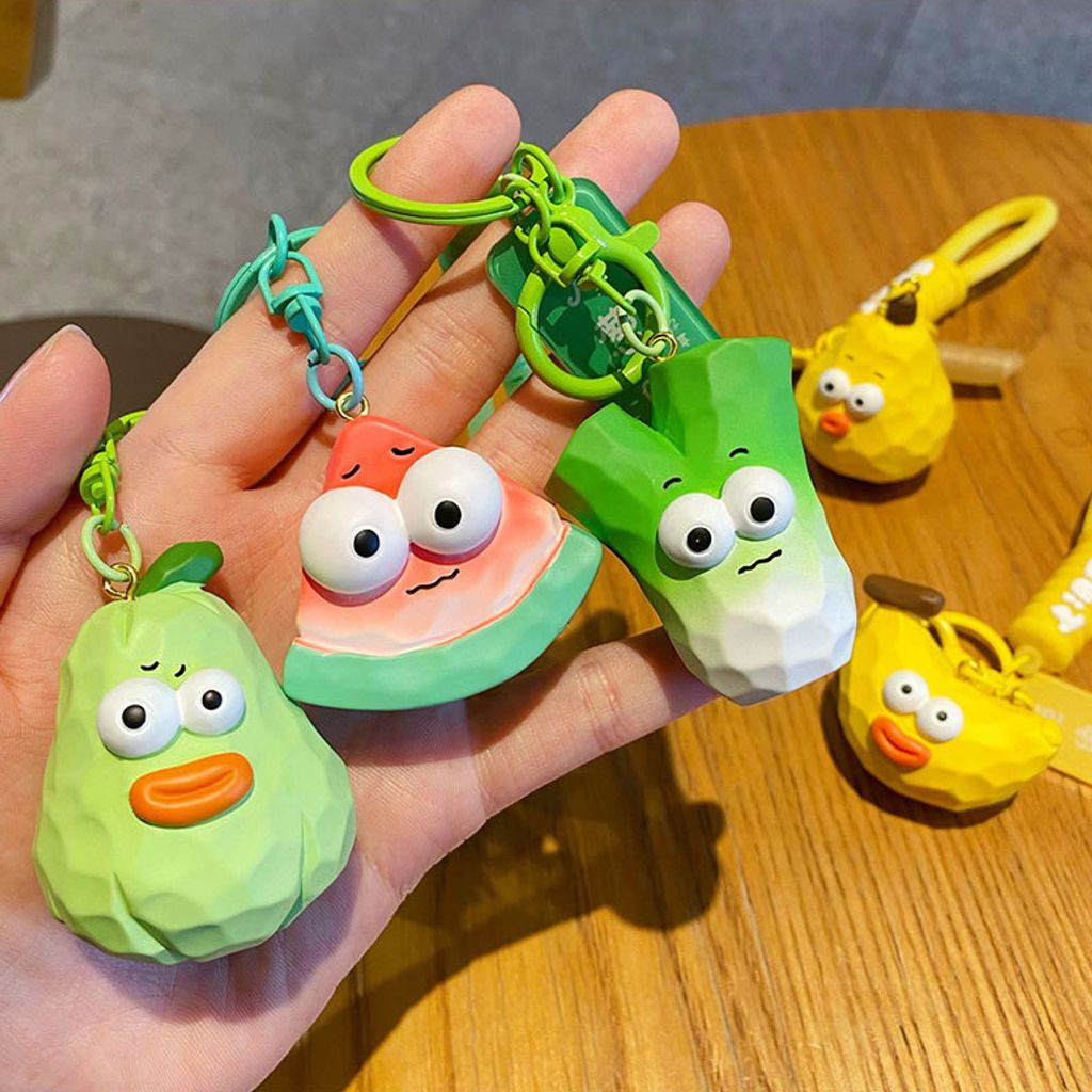 Cute wacky fresh fruit and vegetable wood carving style keychain charms showing multiple designs