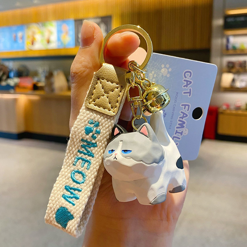 Blue and white cat standing keychain charm