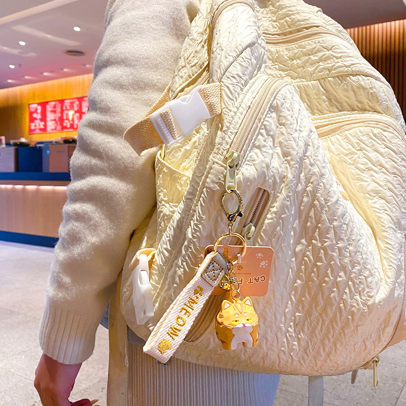 Bengal cat standing keychain charm hanging on a bag