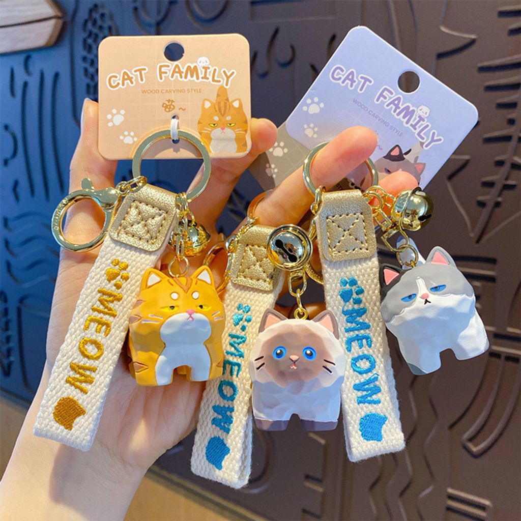 Cute cat family wood carving style keychain charms showing multiple designs