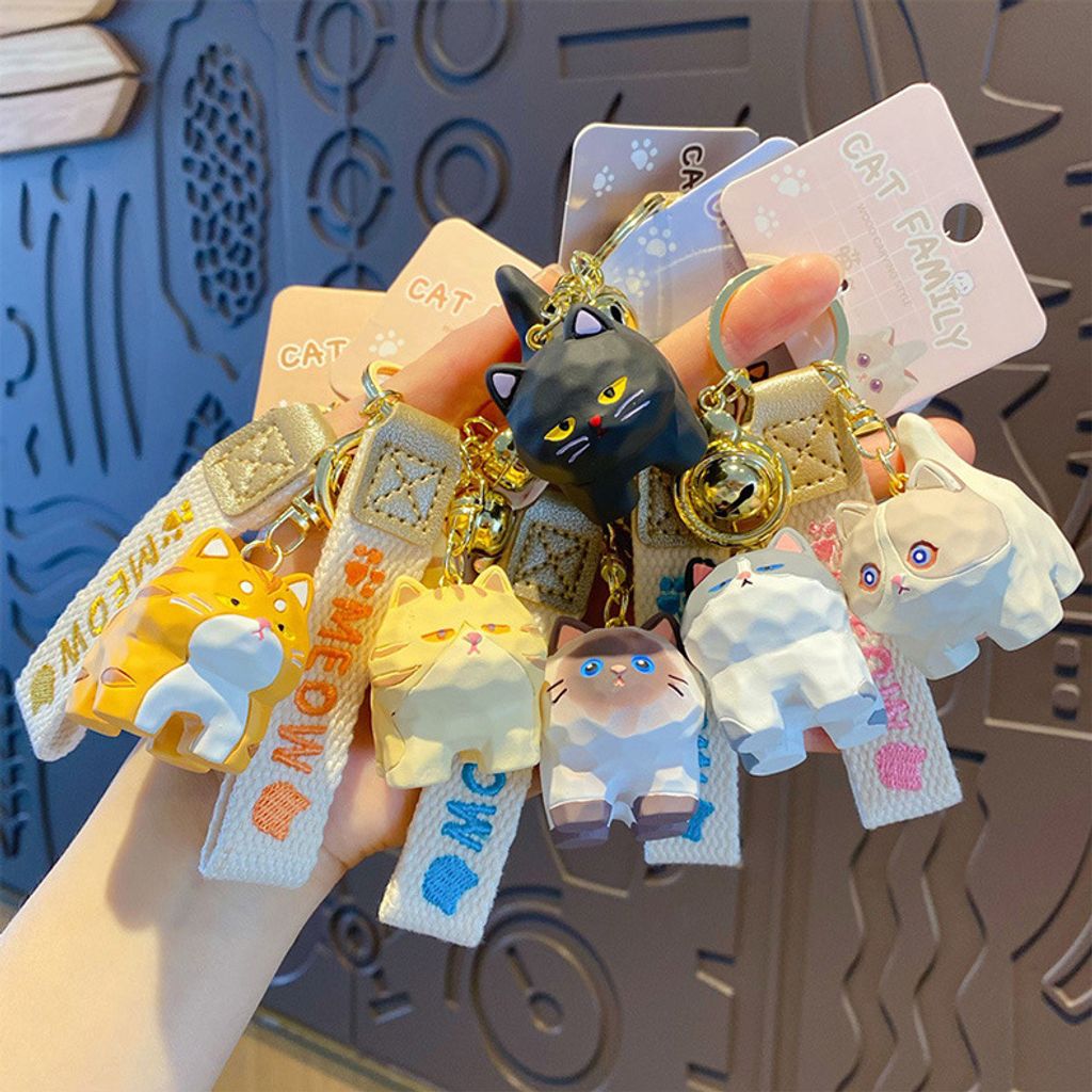 Cute cat family wood carving style keychain charms showing all six designs