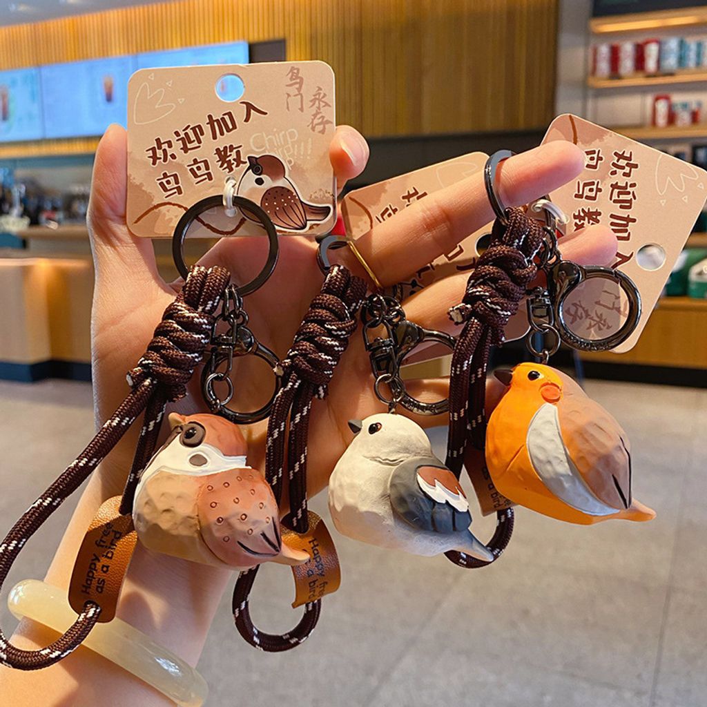 Cute chirpy bird wood carving style keychain charms showing multiple designs