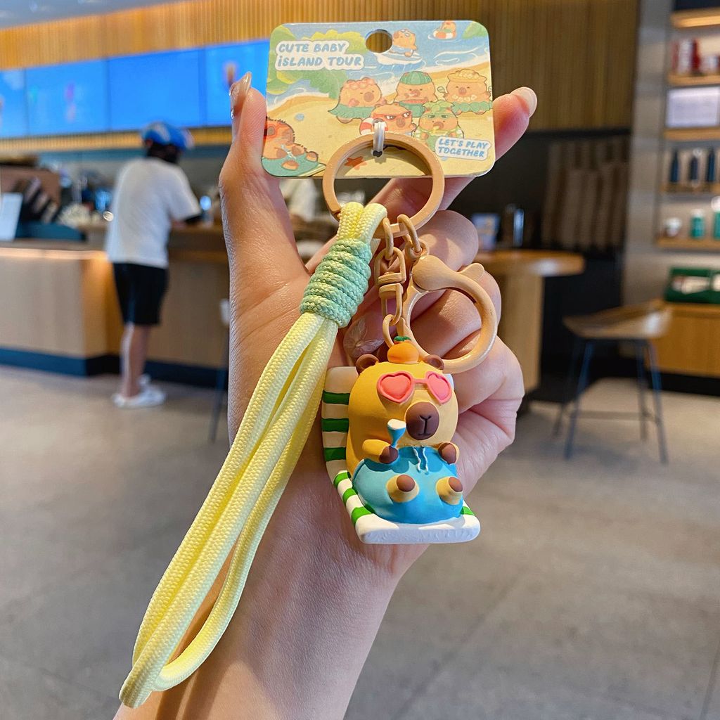 Cute capybara island vacation keychain charm lounge chair capybara variant