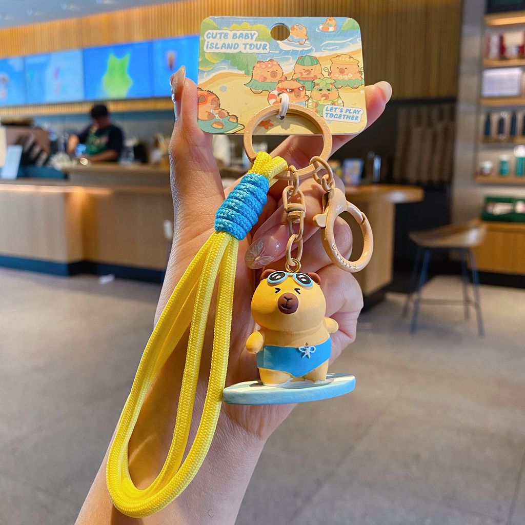 Cute capybara island vacation keychain charm surfer capybara variant