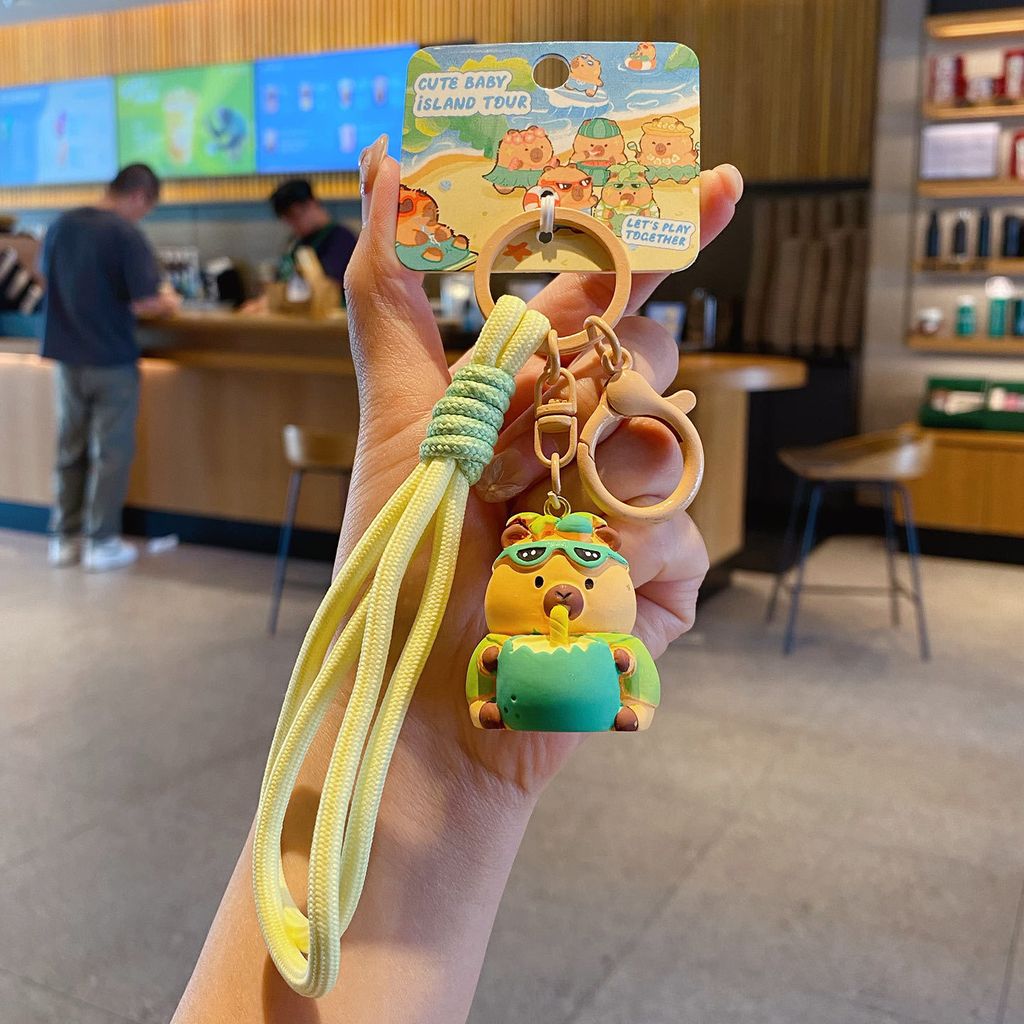 Cute capybara island vacation keychain charm coconut capybara variant