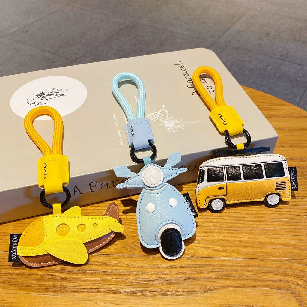 Faux leather vehicle keychain charms showing all three designs