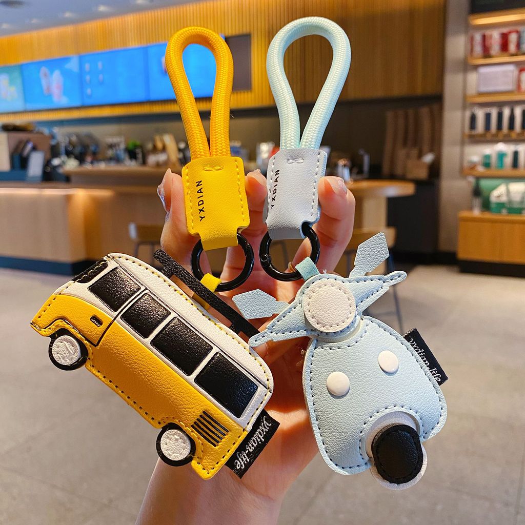 Faux leather vehicle keychain charms bus and motorcycle designs