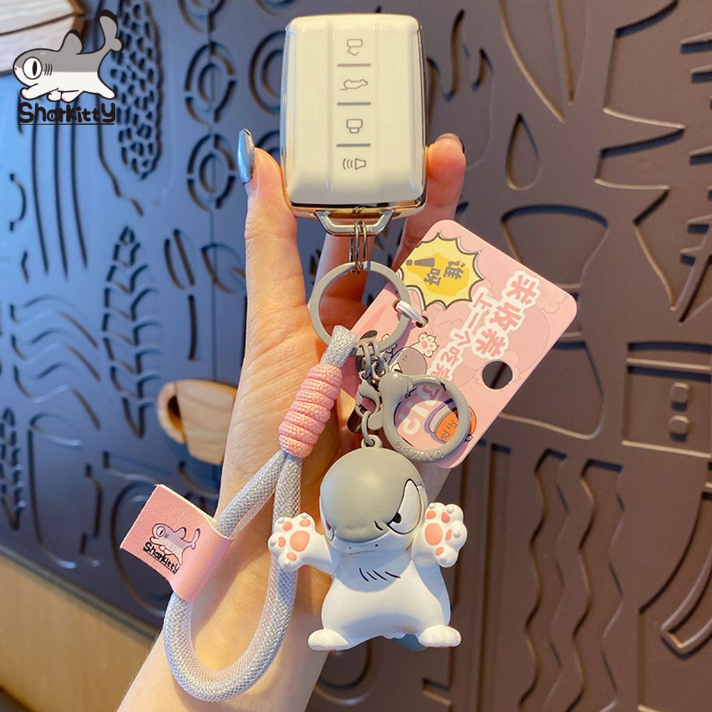 Sharkitty please adopt me keychain charm attached to car keys
