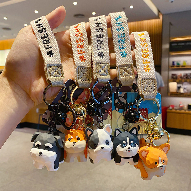 Cute dog family wood carving style keychain charms featuring all five designs