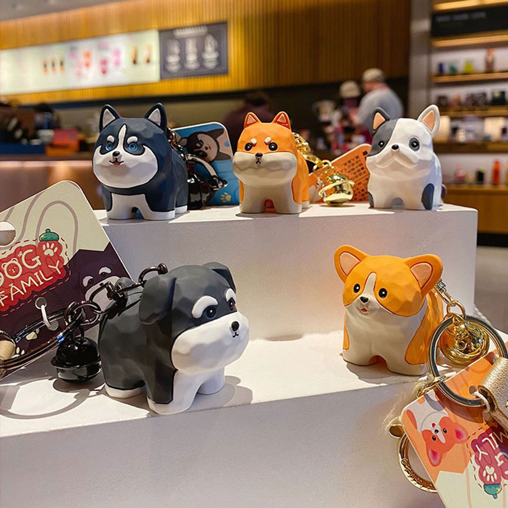 Cute dog family wood carving style keychain charms showing all five designs