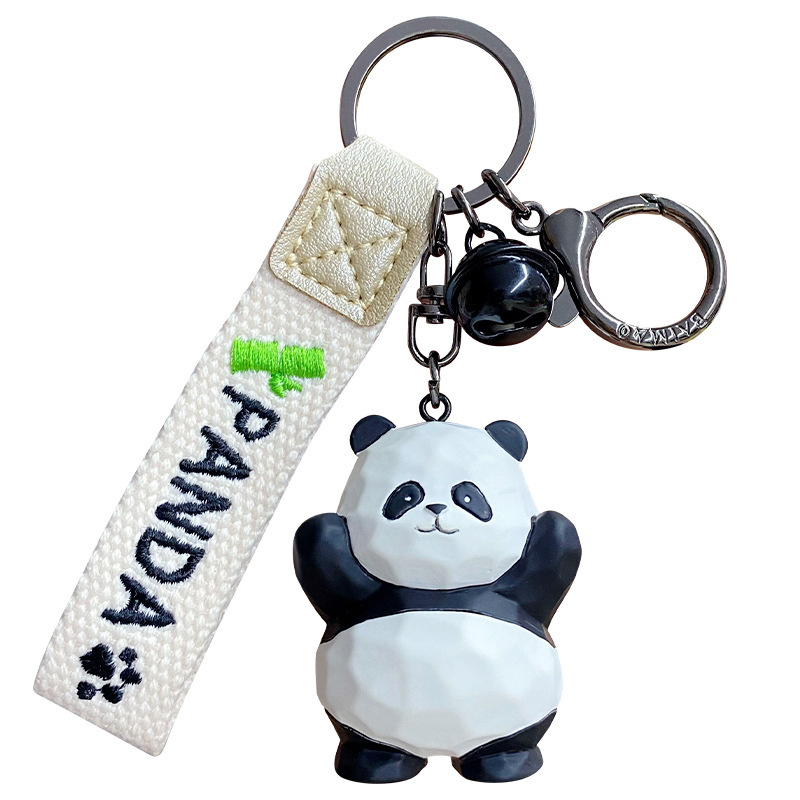 Waving panda keychain charm on white background